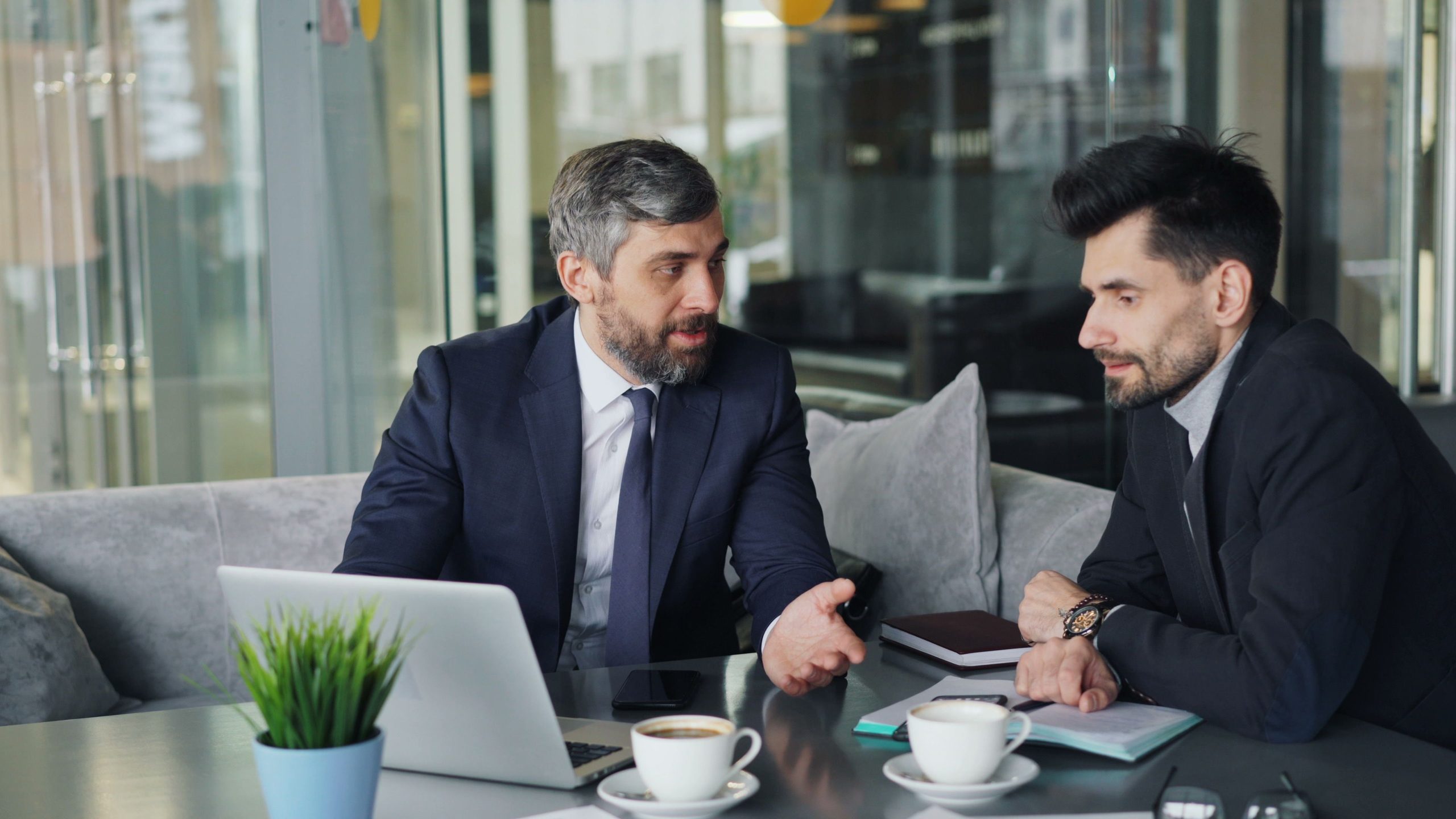 Small business owner and coach reviewing a business growth plan